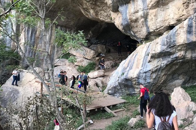From Tirana: Hiking to Pellumbas Cave and Petrela Castle - Inside Pellumbas Cave, the Black Cave, with torch and helmet