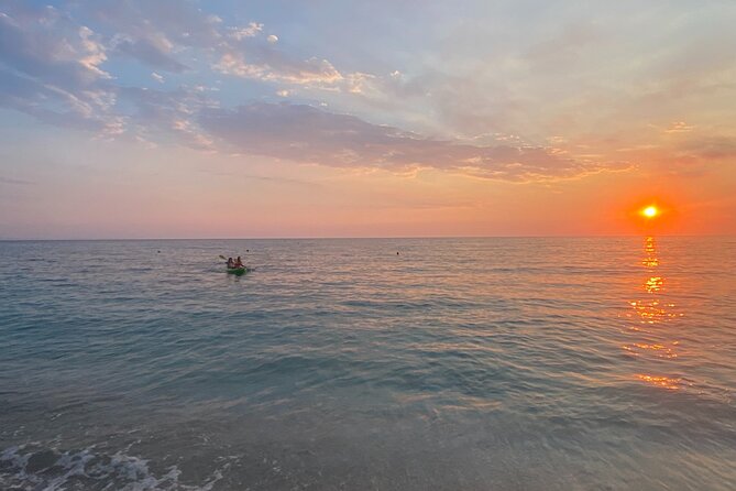 Sunset Saranda and Night City Glow Kayak or Sup Tour - City lights paddle back: dusk energy with neon reflections