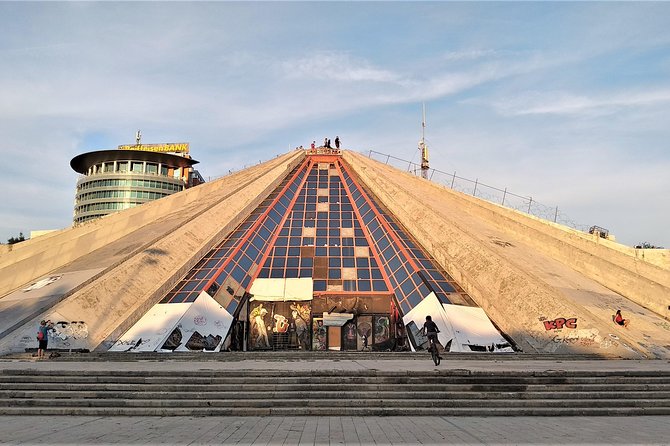 Tirana Walking Tour, Extra Virgin Olive Oil and Raki Tasting - Murat Toptani pedestrian street: a walk through institutions, bridges, and memory